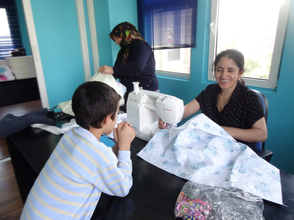 Women producing at the Turquoise Tassel workshop